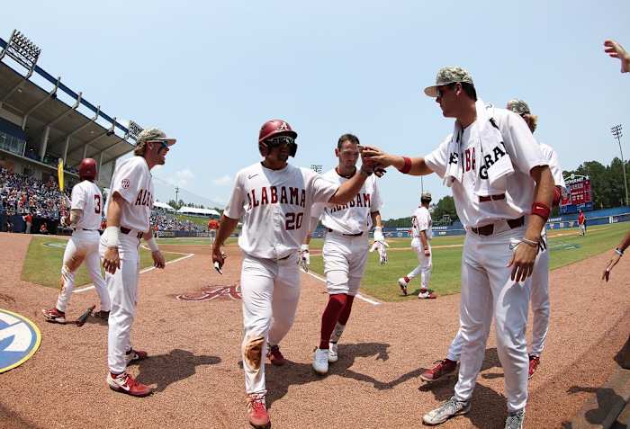 Alabama baseball player Tommy Seidl (20) celebrates against Auburn at Hoover Met in Birmingham, AL on Thursday, May 25, 2023.